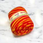 Red and yellow Kalawa Mauli sacred cotton thread roll for puja and religious rituals